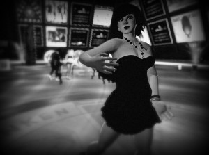 High-contrast black-and-white photograph of Vanessa Blaylock dancing in a "Little Black Dress" (LBD) at Dance Island.