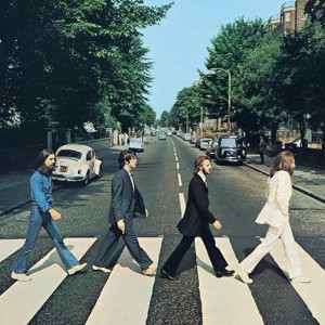 The Beatles walking across Abbey Road