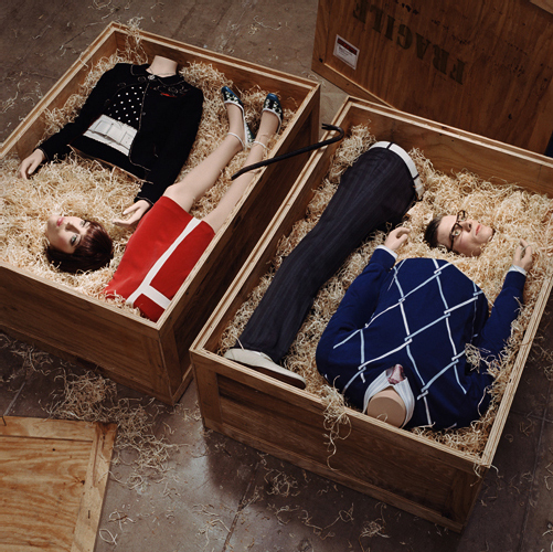 Avatar in a Box: Hugh Kretschmer's 2006 photograph "Special Delivery" depicting 2 people in parts in shipping crates and wearing stylish apparel.