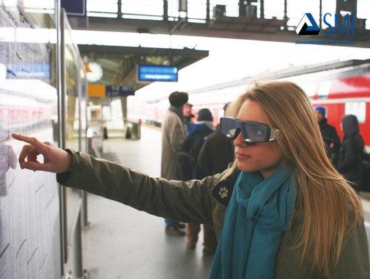 University Guiding Principles: photo of a woman wearing SMI Eye Tracking glasses and working with a wall-mounted subway map