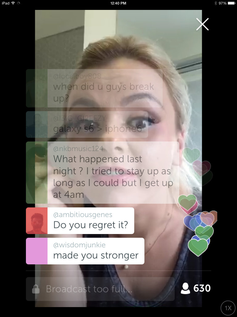 Screen cap of Bree Olson's Periscope broadcast stream. Olson applies mascara as she simultaneously reads viewer comments on her iPhone screen