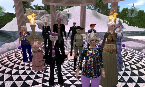 VBCO Cast Members stand on the central mosaic at VBCO Villa at Biscuit Bay, An Li. Each cast member has imagined their future as an avatar senior citizen.
