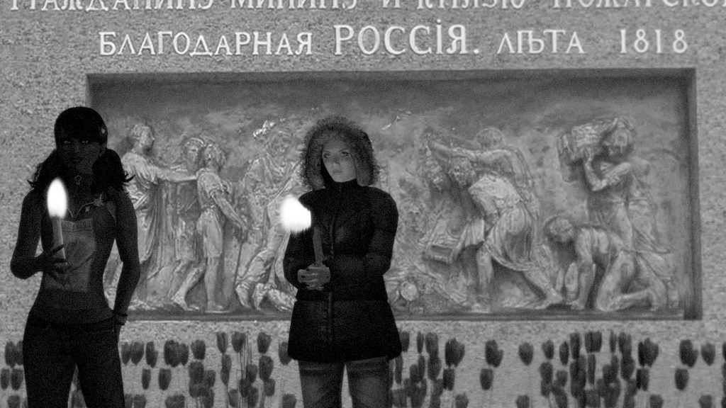 Black-and-white photograph of avatars holding a candlelight vigil in support of Nadya Tolokonnikova's hunger strike