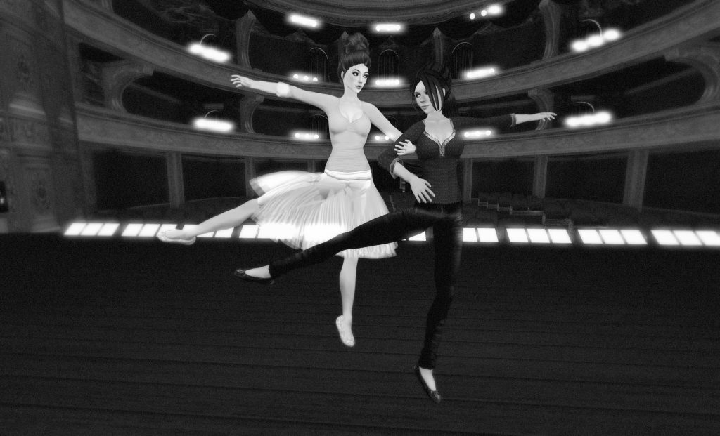 Black-and-white photograph from the Royal Opera House stage looking out toward the house. Agnes Sharple and Vanessa Blaylock, as Margot Fonteyn and Rudolf Nureyev, perform a partner dance.